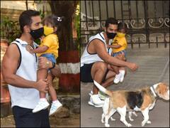 PICS: Angad Bedi Holds Daughter Mehr In Arms As He Plays With Dogs