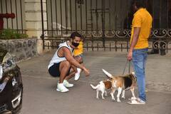 PICS: Angad Bedi Holds Daughter Mehr In Arms As He Plays With Dogs