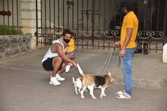 PICS: Angad Bedi Holds Daughter Mehr In Arms As He Plays With Dogs