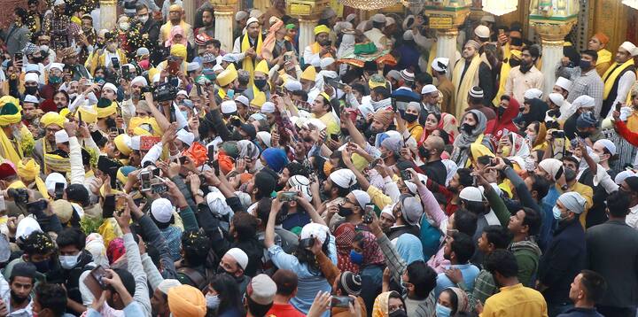 Devotees celebrate Basant Panchami festival at Hazrat Nizamuddin Aulia Dargah in New Delhi. The 12th century old Sufi shrine of Hazrat Nizamuddin is know for exotic activities on the occasion of Basant Panchami every year. (Image: PTI)