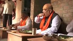 Amit Shah in Bengal: এলেন টোটো চড়ে, শুক্তো-দই-রসগোল্লায় উদ্বাস্তু পরিবারে মধ্যাহ্নভোজ সারলেন অমিত শাহ