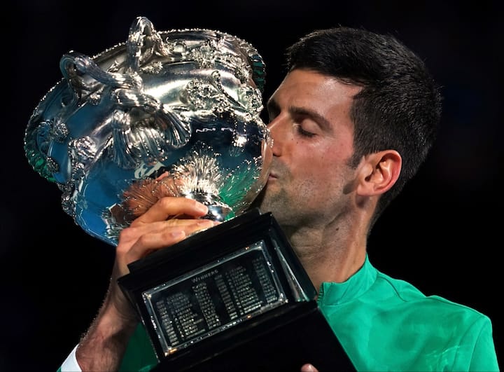 Novak Djokovic kisses the Australian Open Trophy 2021.  (Image Credits- AP/PTI)
