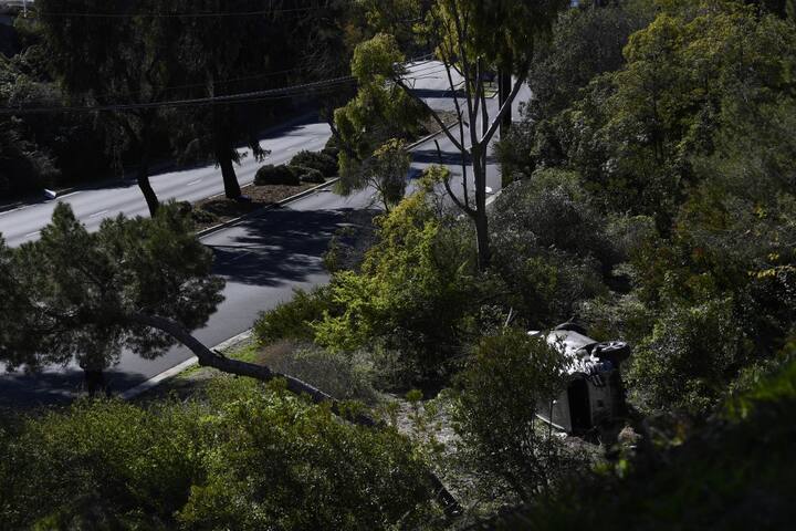 Visual of the broken vehicle driven by golfer Tiger Woods lies on its side in Rancho Palos Verdes, California, on February 23, 2021, after a rollover accident. PIC/AFP.