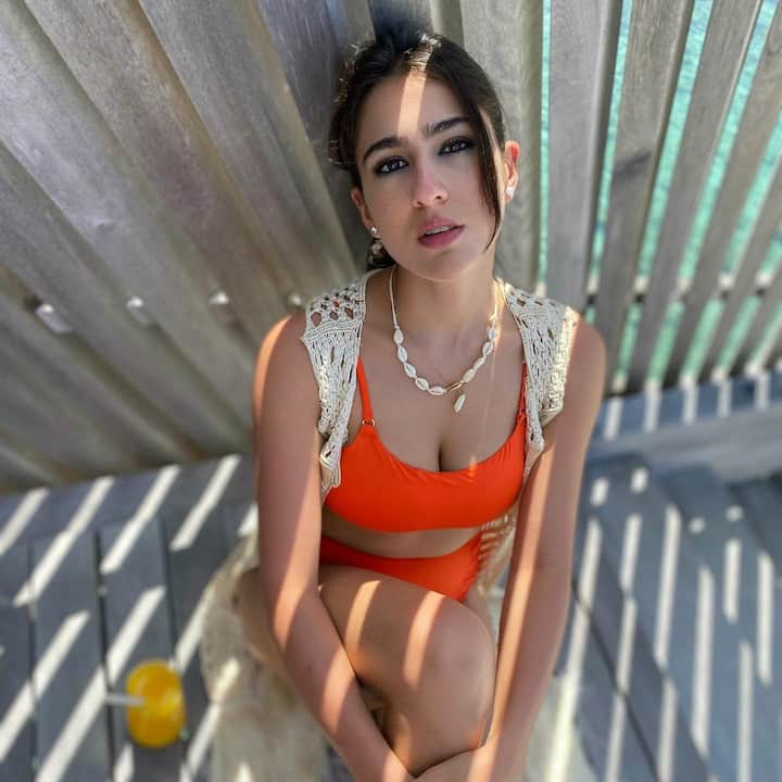 Saif Ali Khan and Amrita Singh's daughter Sara Ali Khan has set the internet on fire with her latest bikini photos. The 'Simmba' actress shared photos wherein she can be seen posing for the camera in a sexy orange bikini.