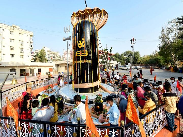 Ahmedabad: Devotees perform Abhishekam to Lord Shiva on the occasion of Maha Shivaratri festival, at Shiva temple in Ahmedabad, Thursday, March 11, 2021. (PTI Photo/Kamal Kishore)