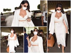 IN PICS: Nora Fatehi's Bold Airport Look In A White Bralette & Pencil Skirt Set Will Leave You Jaw-Dropped!