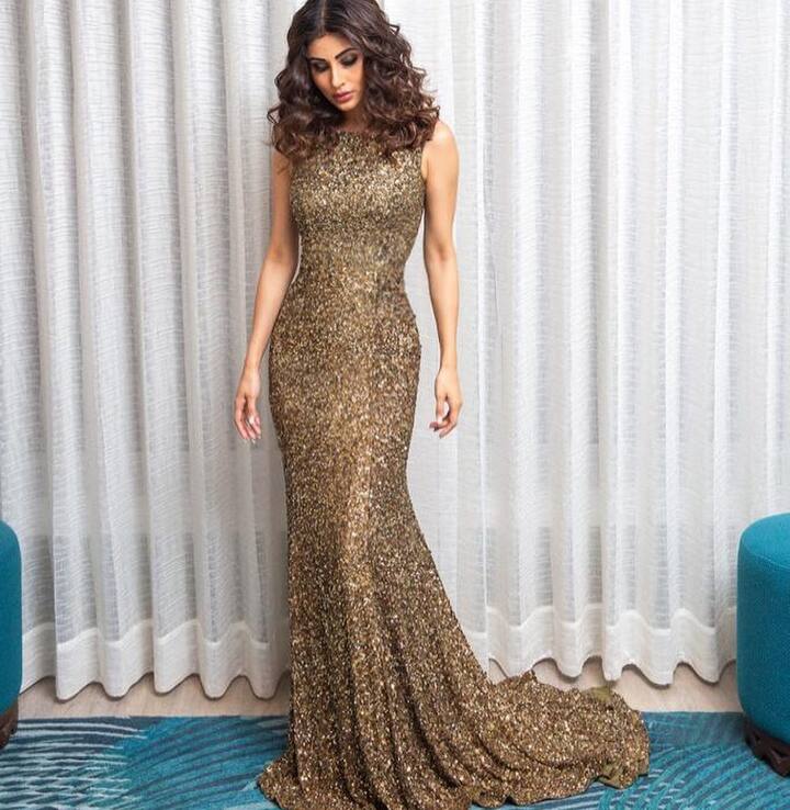 Popular actress Mouni Roy, known for her amazing sartorial choices, has made waves with her new Instagram photos. The 'Naagin' actress looked resplendent in a sparkling golden outfit.
