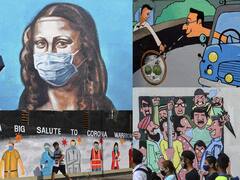 In Pics: भिंतींवर चित्र काढत कलाकारांनी केली जनजागृती