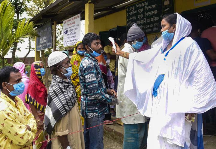 Voters had to wear masks, undergo thermal screening and wear gloves to the pooling booth due to the ongoing Covid-19 pandemic. (Photo: PTI)