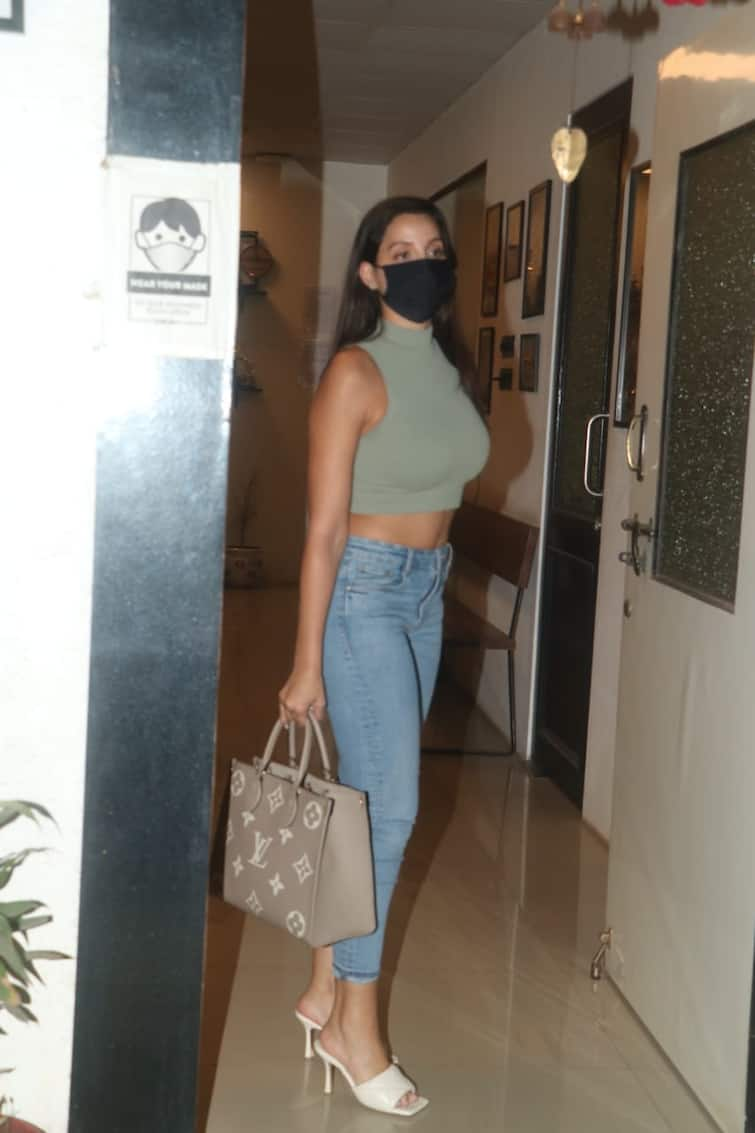 Nora Fatehi pairs ₹4 lakh bag with chic white crop top and denims, see pics