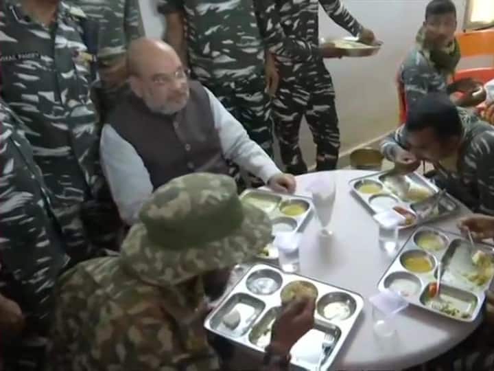 Amit Shah paid tributes to the 23 security personnel who were killed by Naxals in the state on Saturday and later had a meal with CRPF jawans at the CRPF camp in Bijapur. (Image: ANI)