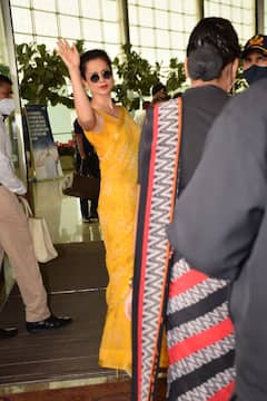 IN PICS: Kangana Ranaut Nails Her Airport Look In A Bright Yellow Saree!