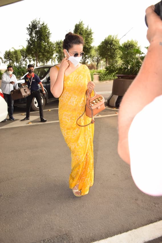 IN PICS: Kangana Ranaut Nails Her Airport Look In A Bright Yellow Sari!