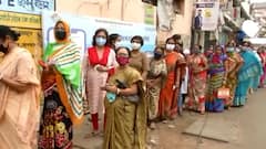 West Bengal Elections 2021: Voters follow COVID norms as they await their turn in long queues