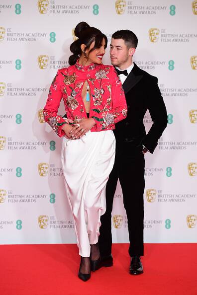 Priyanka and her husband Nick also put on a loved-up display for the paps on the red carpet. [pic credit: Gettyimages]
