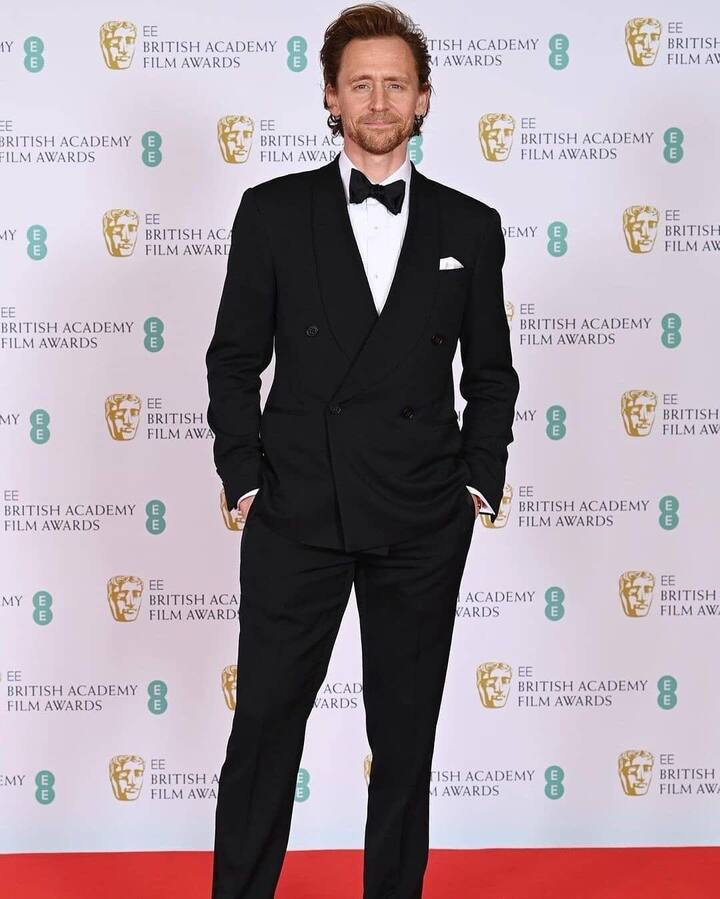 Tom Hiddleston posing at BAFTA 2021