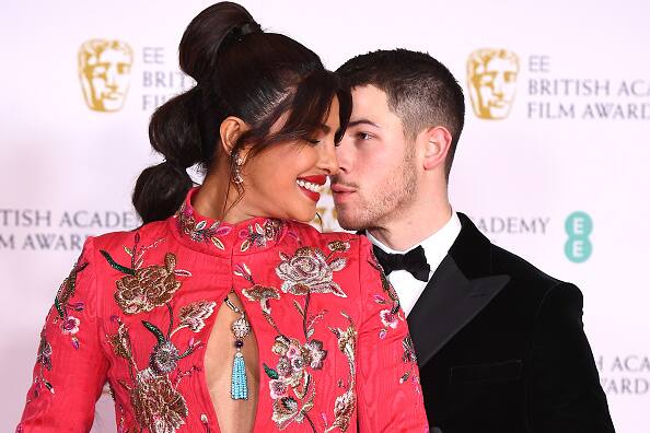 Nick just can't keep eyes of his gorgeous wife. [pic credit: Gettyimages]