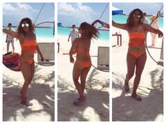 Bigg Boss 13's Arti Singh Raises OOMPH In Orange Bikini While Twirling On The Beach Of Maldives; See Pics!