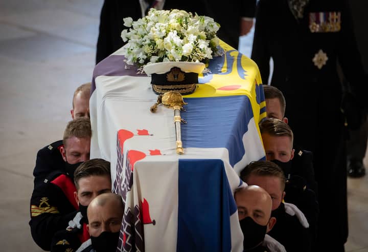 all Bearers carry the coffin during the funeral of the Duke of Edinburgh in St Georges Chapel. Due to Coronavirus restrictions, there will be only 30 mourners for the service, including the widowed queen, her four children and her eight grandchildren. (Image: PTI)