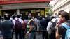 Delhi: Crowd outside liquor shop at Mayur Vihar after lockdown announcement