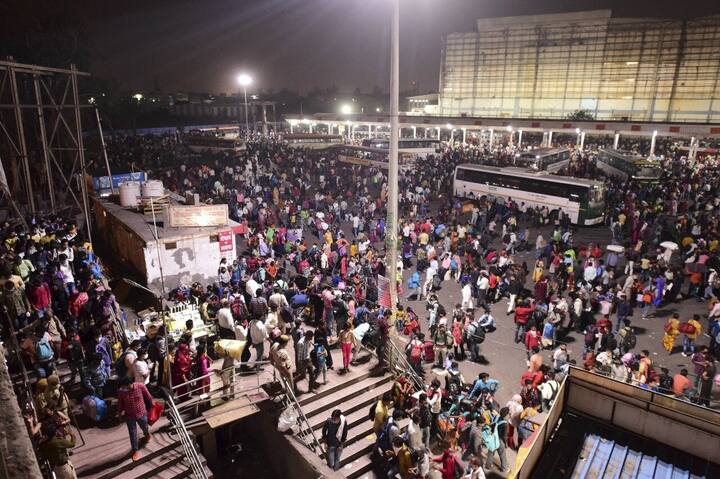 Anand Vihar bus terminal witnessed a huge rush of migrant workers last night who gathered to leave for their native places after Delhi Government announced complete lockdown for 6 days due to surge in coronavirus cases in New Delhi. (Image: PTI)