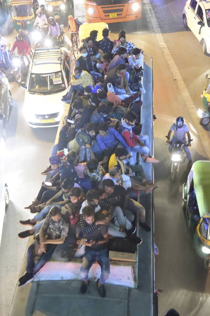 Passengers were seen sitting on the roof of a over crowded bus. (Image: PTI)