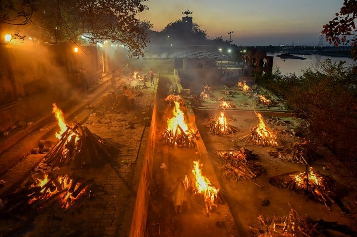 Covid victims being cremated at Bhariv Ghat Hindu Crematory In Kanpur. With over 34,000 fresh COVID-19 cases logged today, Uttar Pradesh witnessed its highest single-day spike in terms of the number of new infections registered in the span of just 24 hours.  (Image: PTI)