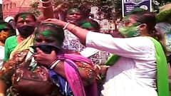TMC workers celebrate victory with colors and crackers