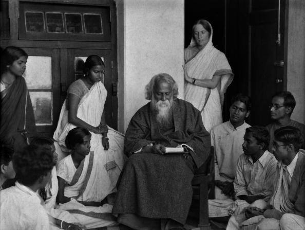 “The highest education is that which does not merely give us information but that makes our life in harmony with all existence.” Students surround writer Rabindranath Tagore at his university, Visva Bharati, in Santineketan, West Bengal, 1929. (Photo by E. O. Hoppe/Getty Images)