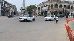UP Lockdown Photos: कहीं सड़कें सुनसान, तो कहीं लगी लोगों की भीड़, तस्वीरों में देखें लॉकडाउन का हाल