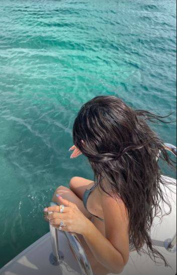 Her soaked brunette locks and a pair of dangling earrings, added more oomph to the pictures. [pic credit: Instagram/Kylie Jenner]