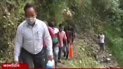 Covid Updates: পিপিই কিট পরে আলিপুরদুয়ারের দুর্গম পাহাড়ি গ্রামে করোনা মোকাবিলায় কালচিনি ব্লকের বিডিও