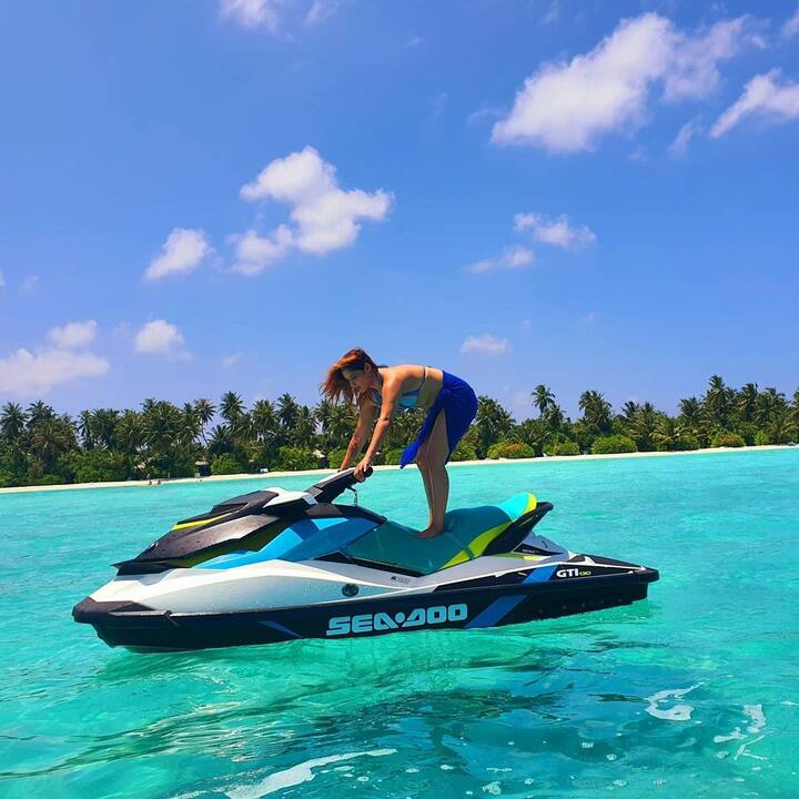 Arti Singh tried her best to strike a pose while standing on a jet ski. Despite her best attempts, she failed.
