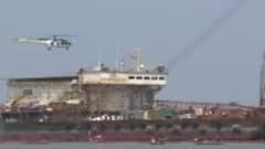 Exclusive visuals of coast guard helicopter inspecting stranded ship in Palghar