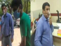 ஆக்ஸிஜன் சிலிண்டருடன் வேலைக்கு வந்த வங்கி மேலாளர்: நெருக்கடியா? நாடகமா?