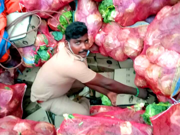 Two arrested for smuggling liquor between cabbage bundles திருக்கோவிலூர் : முட்டைகோஸ் மூட்டைகளுக்கிடையே மதுபாட்டில்களை பதுக்கி கடத்திய இருவர் கைது