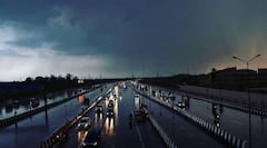 IN PICS | Heavy Rains, Gusty Winds In Delhi Leave Behind Uprooted Trees, Traffic Jams & Diverted Flights