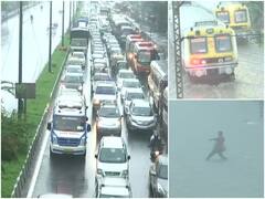 Mumbai Rains Photos: पहली बारिश में पानी-पानी हुई मुंबई, सड़कों पर पानी भरने से ट्रैफिक जाम