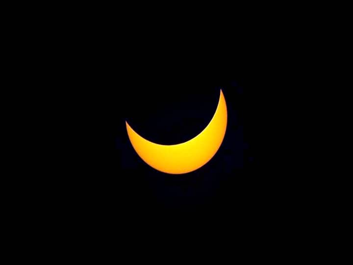 View of the sun partially covered by the moon during the partial solar eclipse in Buenos Aires on December 14, 2020. (JUAN MABROMATA / AFP)