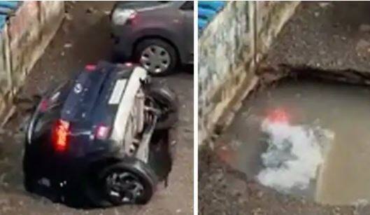 parked car getting swallowed into the ground in seconds ghatkopar mumbai watch video  આંખના પલકારામાં પાર્કિંગમાં ઉભેલી કાર પાણીમાં થઈ ગરકાવ, જુઓ હેરાન કરતો વીડિયો