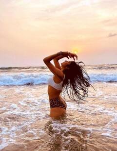 IN PICS: Janhvi Kapoor Strikes A Stunning Pose In Bikini As She Enjoys Sunset With A Mystery Guy!