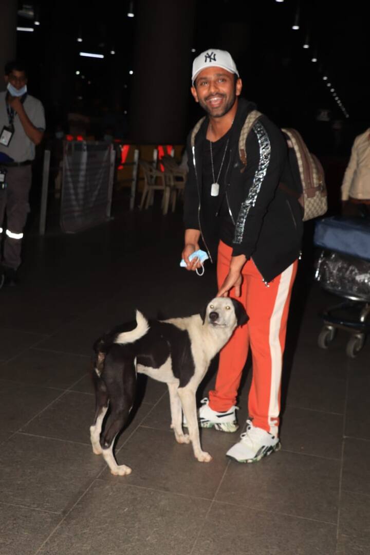 Rahul Vaidya greeted by a dog while he was exciting the airport. [pic credit: Manav Manglani]
