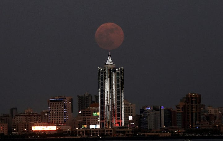 The celestial event has got the Strawberry Moon not because it looks like a strawberry. It got its name from ancient American tribes who marked the full moon with the beginning of the harvesting season for strawberries. (Image: AFP)