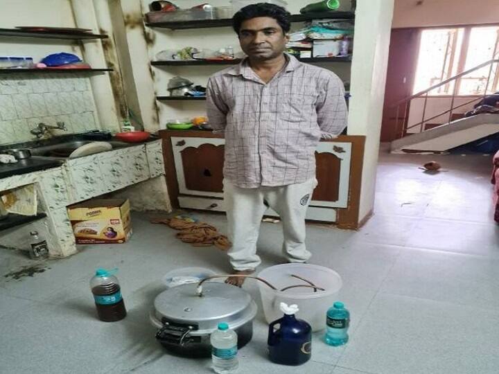 Man arrested for Counterfeit liquor sale taught self through youtube videos liquor preparation production arrest mohan nair கோவையில் யூ ட்யூப் பார்த்து கற்றுக்கொண்டு, குக்கரில் கள்ளச்சாராயம் காய்ச்சி விற்பனை செய்தவர் கைது!