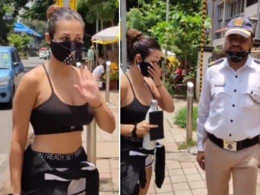Malaika Arora Doesn’t Look Pleased As Traffic Cop Removes Mask For PIC- Watch Malaika Arora Doesn’t Look Pleased As Traffic Cop Removes Mask For PIC- Watch