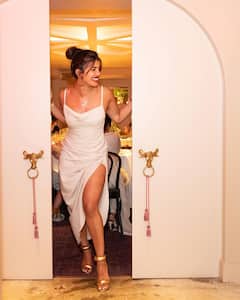 PICS: Priyanka Chopra Looks Ravishing In High Slit Satin Dress As She Poses At Her NYC Restaurant