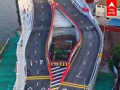 இடத்தை காலி செய்ய மறுத்த பெண் - வழியில்லாமல் வீட்டைச்சுற்றி பாலம் கட்டிய சீனஅரசு