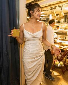 PICS: Priyanka Chopra Looks Ravishing In High Slit Satin Dress As She Poses At Her NYC Restaurant