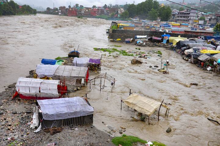 Incessant heavy rains and thunderstorm has crippled the normal life and triggered a flood-like situation in several districts of Himachal Pradesh and Uttarakhand. Here's a view of Beas river in spate after heavy rain in Kullu district. (Image: PTI)