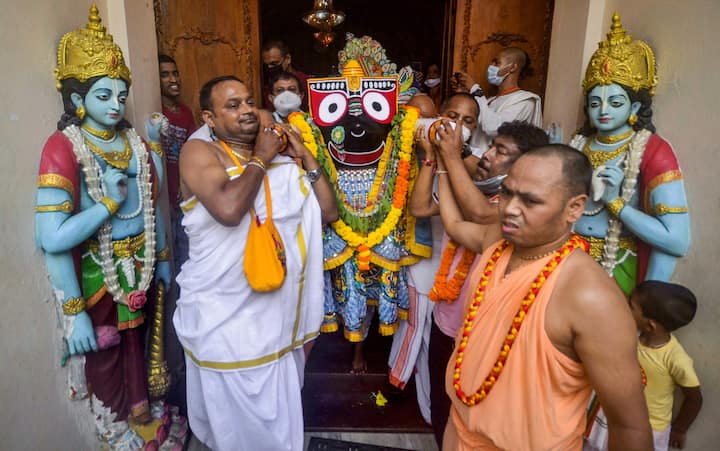 According to the Hindu calendar, there is a ritual to take out Jagannath Rath Yatra every year on the second date of Shukla Paksha of Ashadh month. It is a religious belief that just a mere glance of this Rath Yatra allows the devotees to be absolved from all sins and they attain salvation after death. In the image, devotees perform a ritual during the annual Rath Yatra festival in Agartala. (Image Source: PTI)
